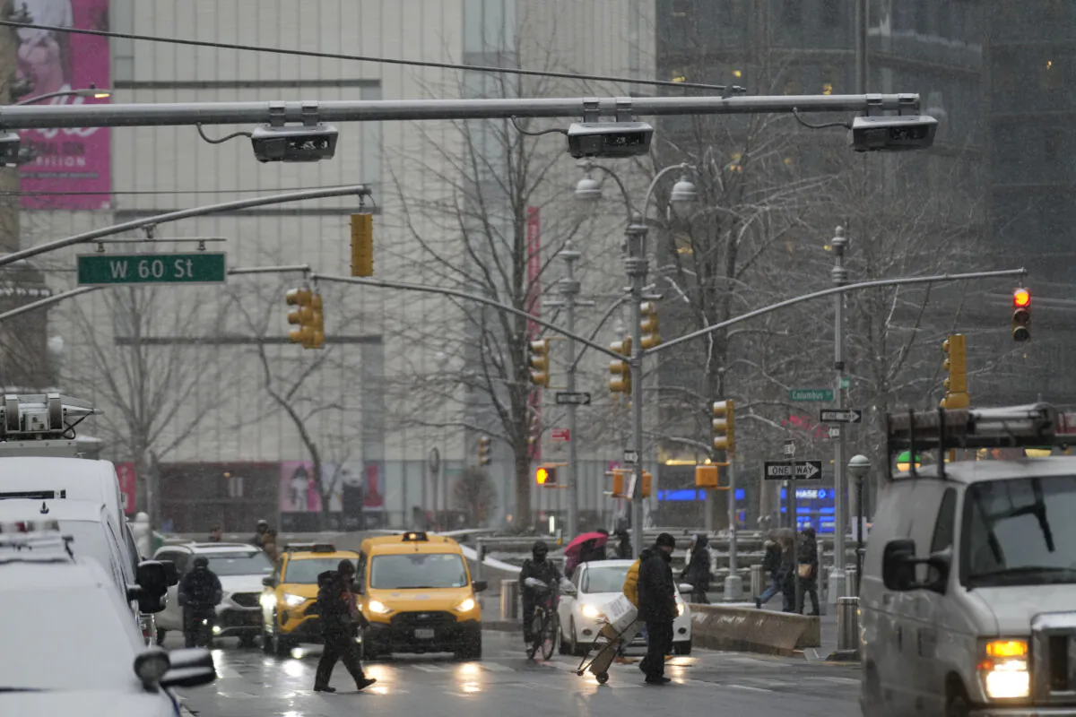 Devices used for congestion tolling hang above traffic on a Manhattan street in New York City on Jan. 6, 2025. (Seth Wenig/AP Photo)