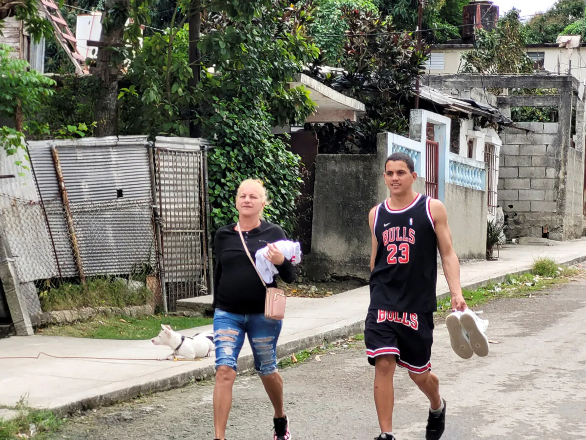 Dariel Cruz, 23, who has just been released from jail, walks down the road towards his family house in La Guinera neighborhood, Havana, Cuba, on Jan. 15, 2025. (David Sherwood/Reuters)
