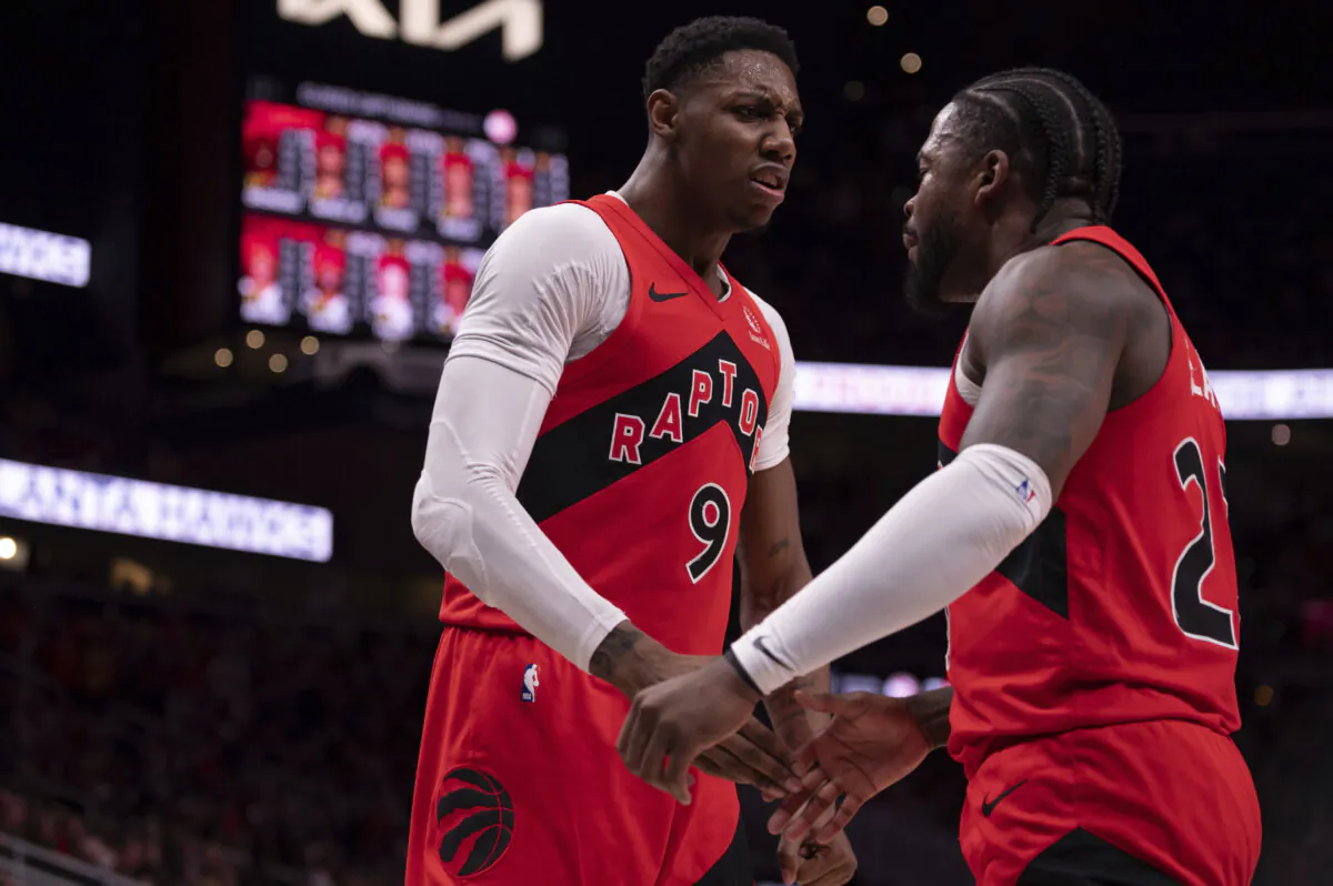 Toronto Raptors guard R.J. Barrett (9) and Toronto Raptors guard Jamal Shead (23) celebrate during the first half of an NBA basketball game between the Atlanta Hawks and Toronto Raptors, in Atlanta, on Jan. 25, 2025. (Kathryn Skeean/AP Photo)