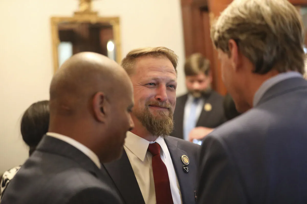 South Carolina Rep. Branon Guffey speaks to senators outside the House chamber in Columbia, S.C., on May 2, 2023. (Jeffrey Collins/AP Photo)
