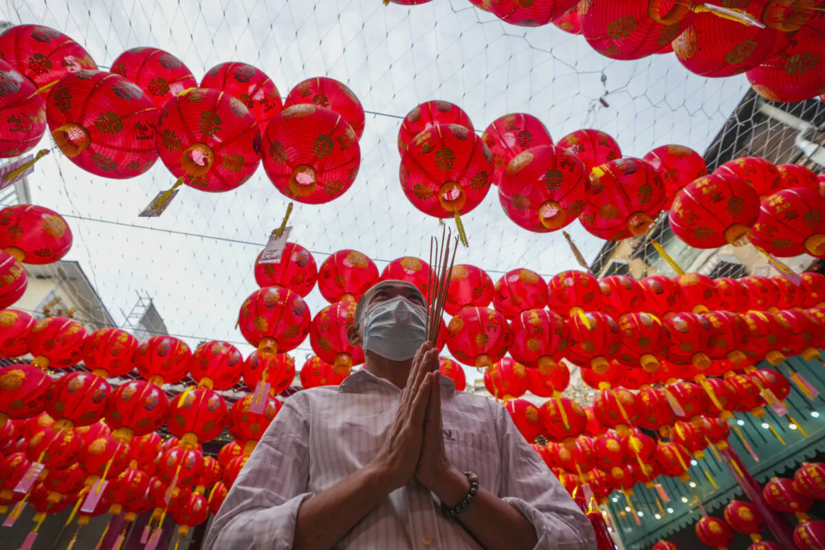 An Ethnic Chinese Thai prays at Kwong Siew Shrine to celebrate the Lunar New Year in Bangkok, Thailand, on Jan. 29, 2025. (Sakchai Lalit/AP Photo)