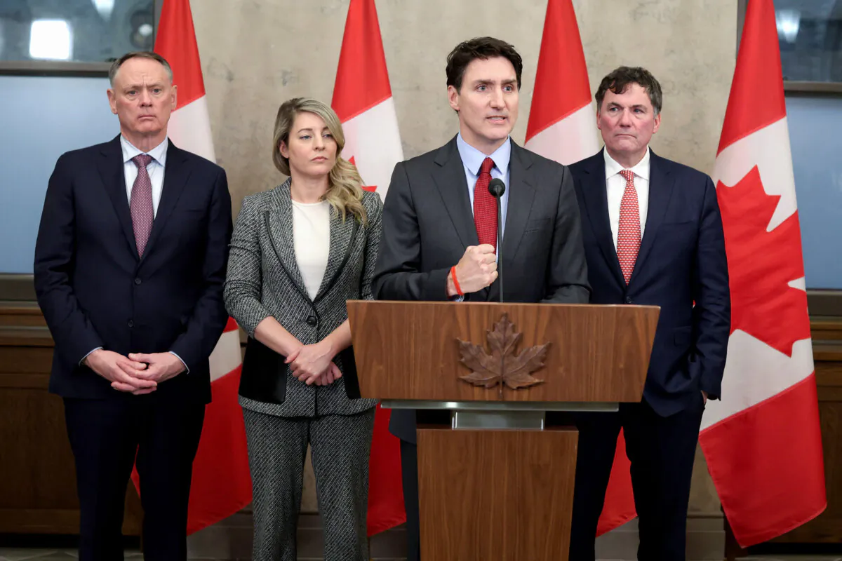 Canada's Prime Minister Justin Trudeau speaks, flanked by (from L) Minister of Public Safety David McGuinty, Minister of Foreign Affairs Melanie Joly and Minister of Finance and Intergovernmental Affairs Dominic LeBlanc, during a news conference on Parliament Hill in Ottawa, Canada, on Feb. 1, 2025. (Dave Chan/AFP via Getty Images)