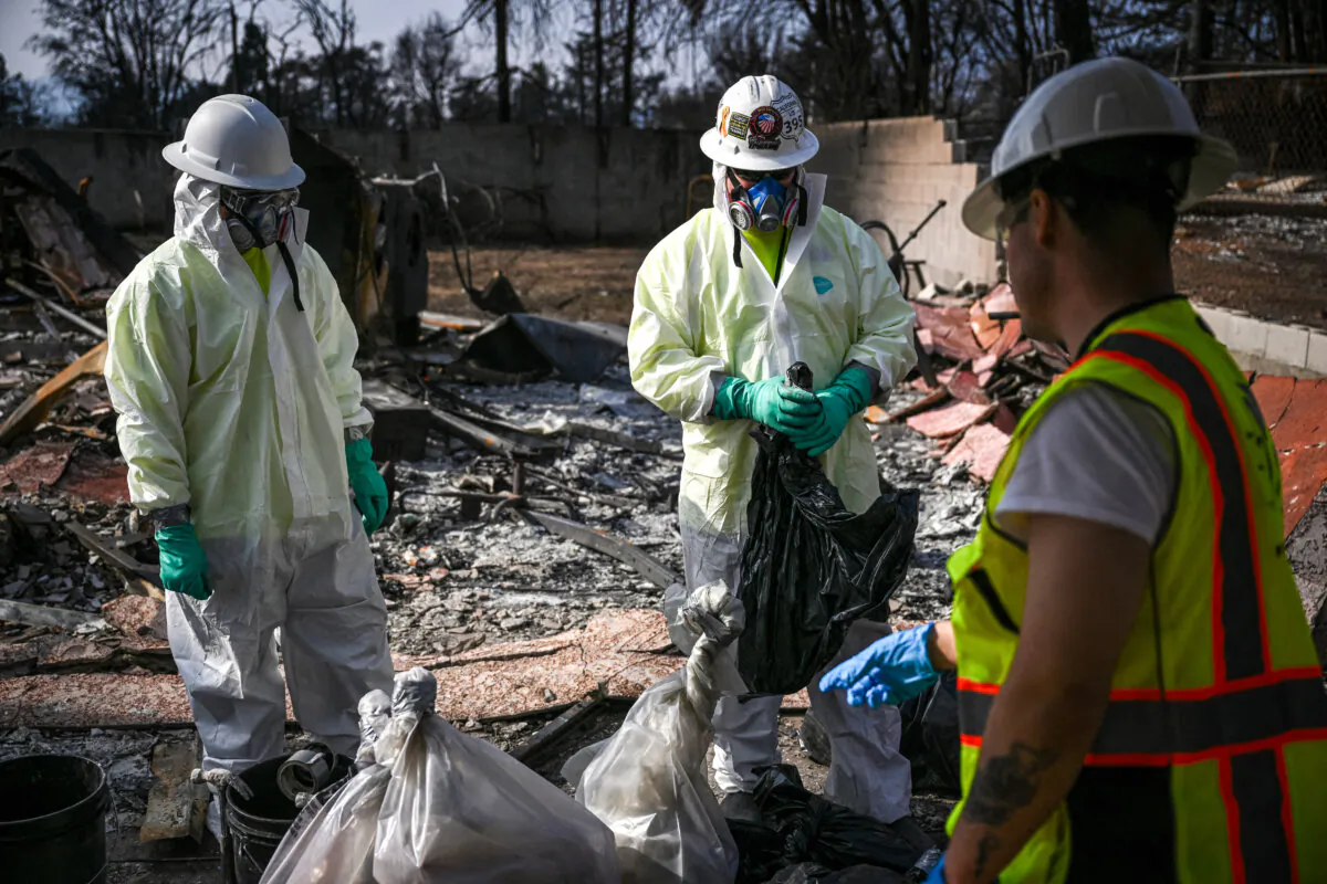 Contractors for the Environmental Protection Agency remove household hazardous waste as they search through homes damaged and destroyed by the Eaton fire in the Altadena neighborhood of Los Angeles County on Jan. 30, 2025. (Patrick T. Fallon/AFP via Getty Images)