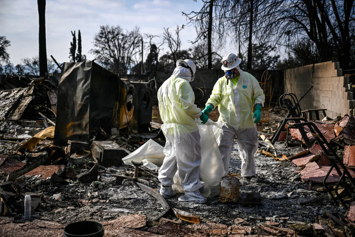 Contractors for the Environmental Protection Agency (EPA) remove household hazardous waste as they search through homes damaged by the Eaton Fire in Altadena, Calif., on Jan. 30, 2025. (Patrick T. Fallon/AFP via Getty Images)