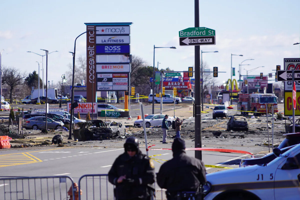 The crash site of the medical evacuation plane near Roosevelt Mall is still being cleared, in Northeast Philadelphia, Penn., on Feb. 1, 2025. (William Huang/The Epoch Times)