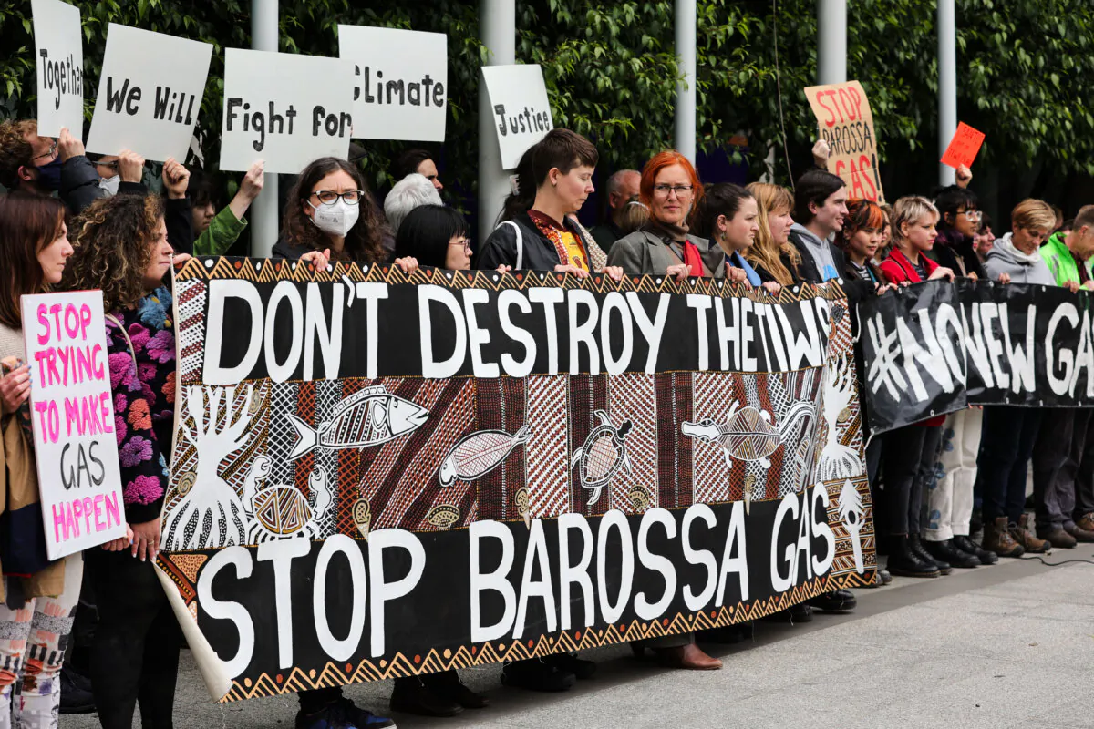 Protesters gather at the front of the Federal Court of Australia in Melbourne, Australia on Nov. 15, 2022. This case involves Santos Ltd., and the major Barossa Gas project, located near the Tiwi Islands off the northern coast of Australia. (Tamati Smith/Getty Images)