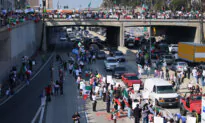Los Angeles Protesters Block Freeway, Spray Graffiti, Vandalize Car