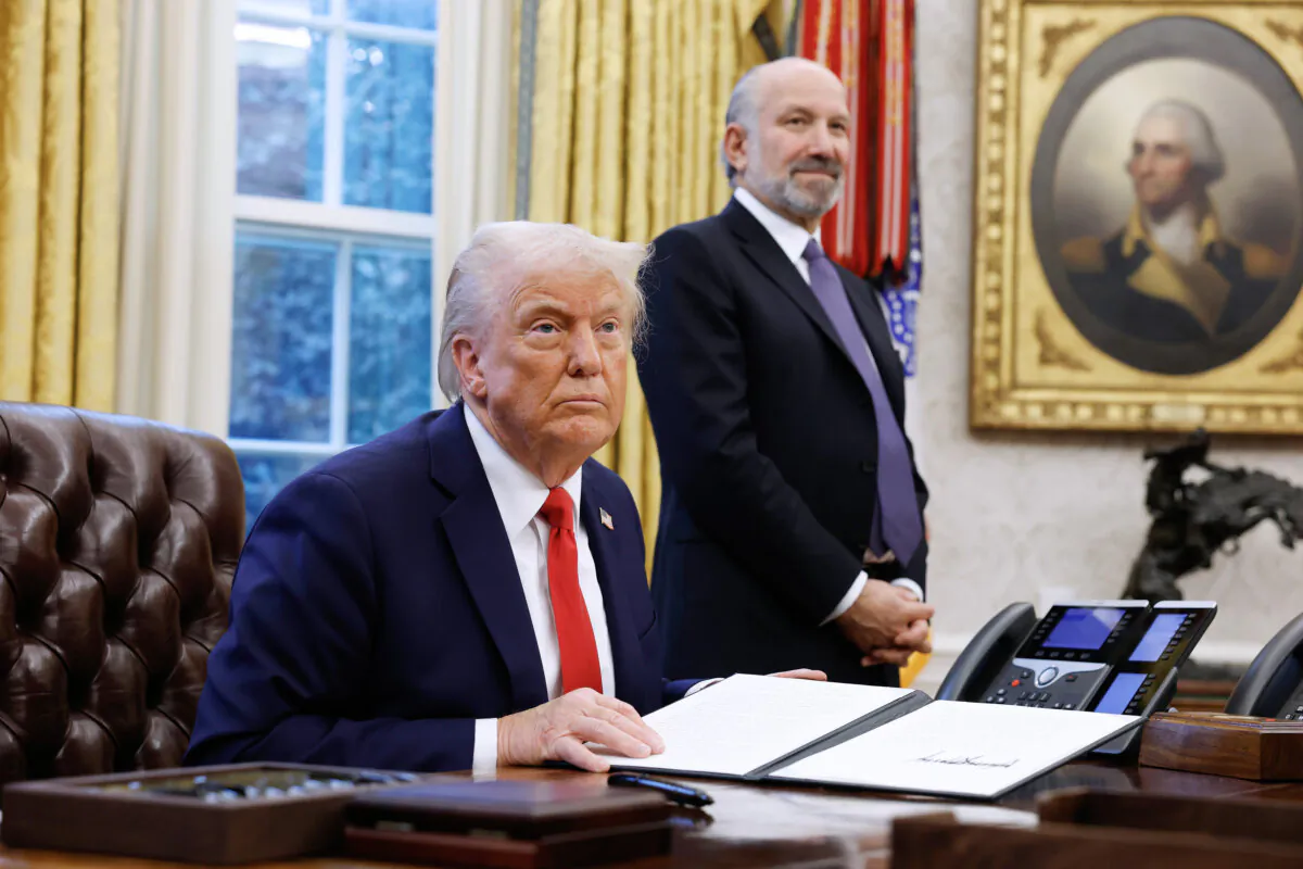 President Donald Trump, alongside Howard Lutnick, his nominee for secretary of the Department of Commerce, speaks to reporters in the Oval Office on Feb. 3, 2025. (Anna Moneymaker/Getty Images)