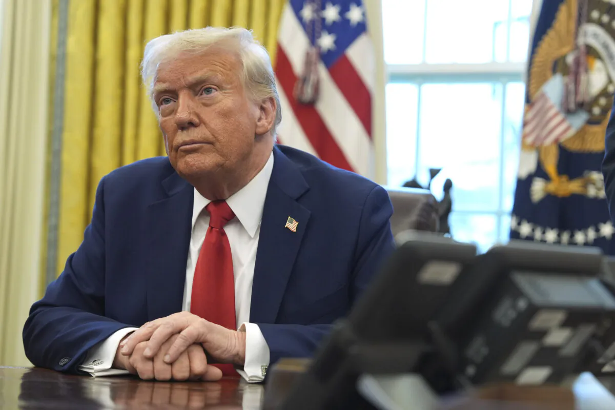 President Trump listens after signing executive orders in the Oval Office of the White House in Washington, on Feb. 3, 2025. (The Canadian Press/AP/Evan Vucci)
