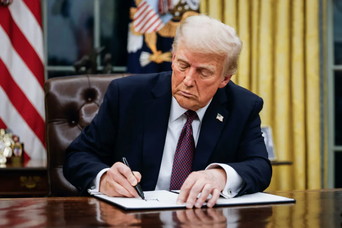 President Donald Trump signs executive orders in the Oval Office on Jan. 20, 2025. (Anna Moneymaker/Getty Images)