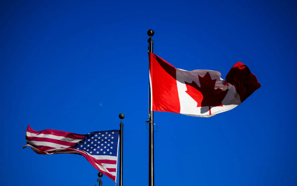 The flags of Canada and the United States in a file photo. (The Canadian Press/Justin Tang)