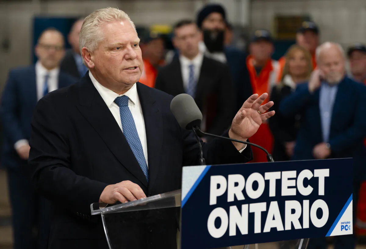 Progressive Conservative Leader Doug Ford speaks from the podium during a visit to Walker Construction in St. Catharines, Ont., on Jan. 31, 2025. (The Canadian Press/Peter Power)