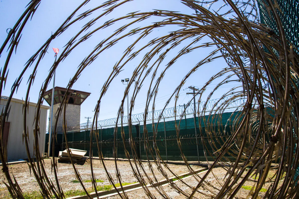 The control tower is seen through the razor wire inside the Camp VI detention facility in Guantanamo Bay Naval Base, Cuba, on April 17, 2019. (Alex Brandon/AP Photo)