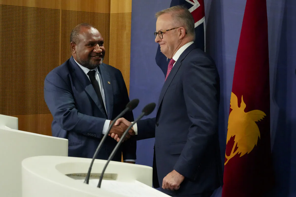Australian Prime Minister Anthony Albanese (R) shakes hands with Papua New Guinea Prime Minister James Marape at a press conference in Sydney, Australia, on Dec. 12, 2024. (AP Photo/Mark Baker)