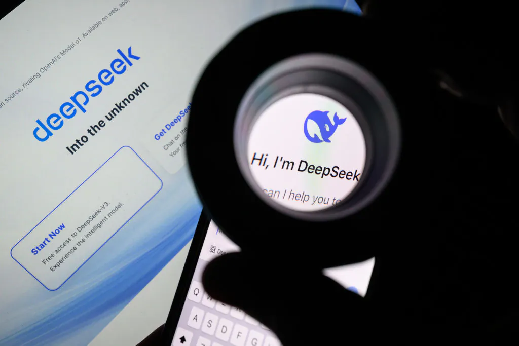 In this photo illustration, the Deepseek logo is seen through a magnifying loupe while displayed on a mobile phone screen in London, England, on Jan. 29, 2025. (Leon Neal/Getty Images)