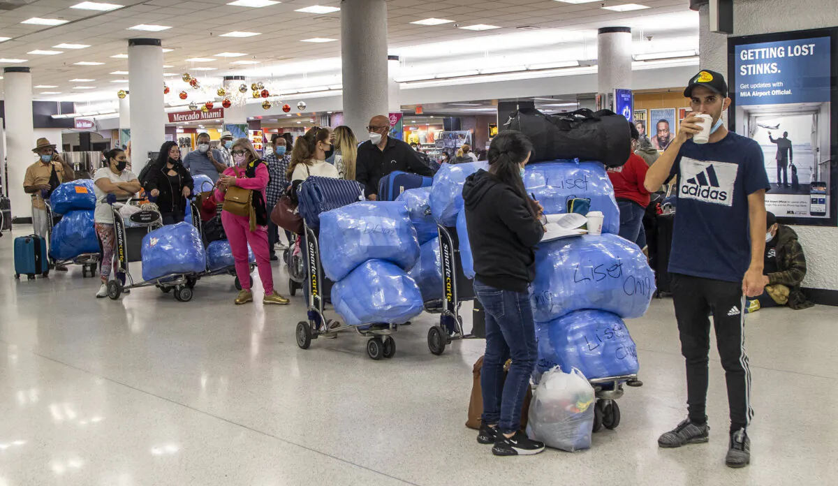 Travelers heading to Cuba are seen at Miami International Airport on Dec. 23, 2021. (Pedro Portal/Miami Herald/TNS)