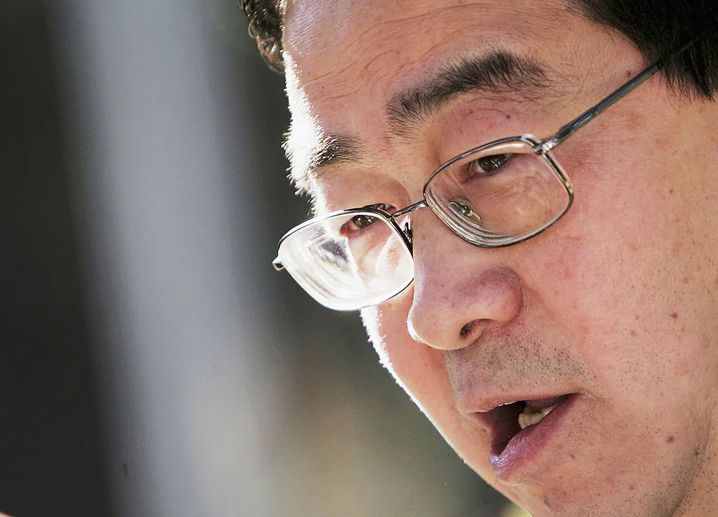 Yang Jun, former leader of the Chinese Students Democratic Movement of Australia, speaks during an event to commemorate the sixth anniversary of the beginning of the persecution of Falun Gong in Sydney Australia on July 20, 2005. (Ian Waldie/Getty Images)