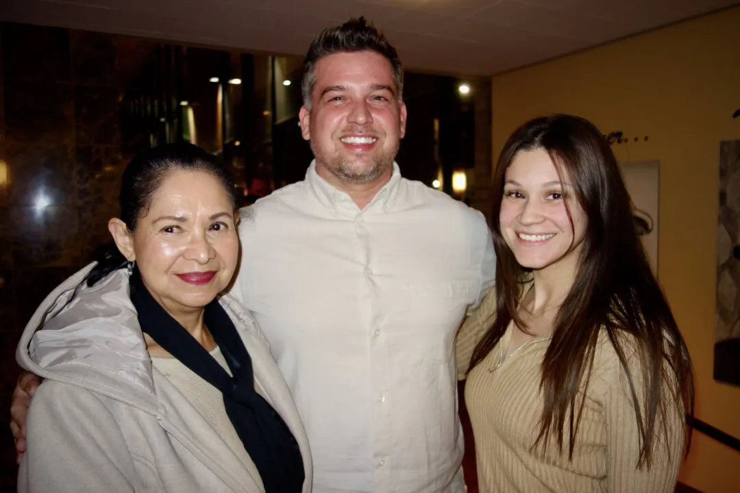 Jordan Slauter (C), his girlfriend, and her mother at the Shen Yun Performing Arts performance at William Saroyan Theatre on Feb. 4, 2025. (Lily Yu/The Epoch Times)
