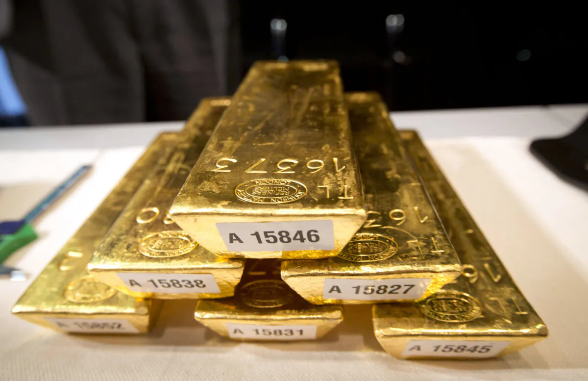 Bars of gold are piled up during a press conference at the German Federal Bank in Frankfurt am Main, western Germany, on Jan.16, 2013. (Frank Rumpenhorst/DPA/AFP via Getty Images)
