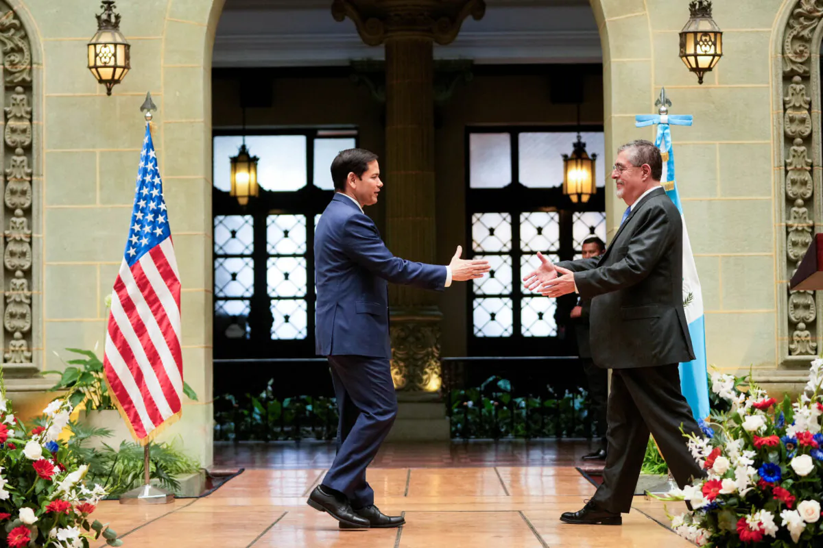 Secretary of State Marco Rubio and Guatemalan President Bernardo Arevalo reach out to shake hands at the end of their joint news conference at the National Palace in Guatemala City, on Feb. 5, 2025. (Mark Schiefelbein/Pool via Reuters)