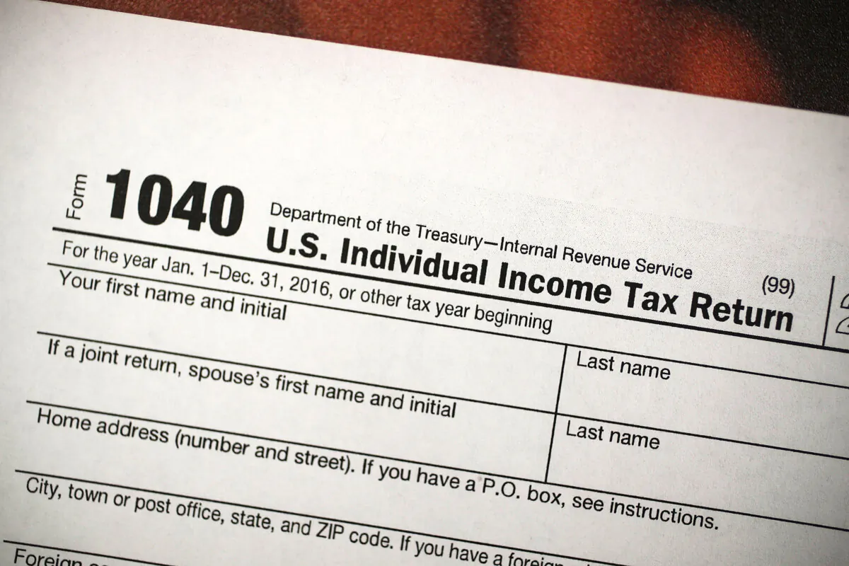 A copy of an IRS 1040 tax form at an H&R Block office in Miami on Dec. 22, 2017. (Joe Raedle/Getty Images)