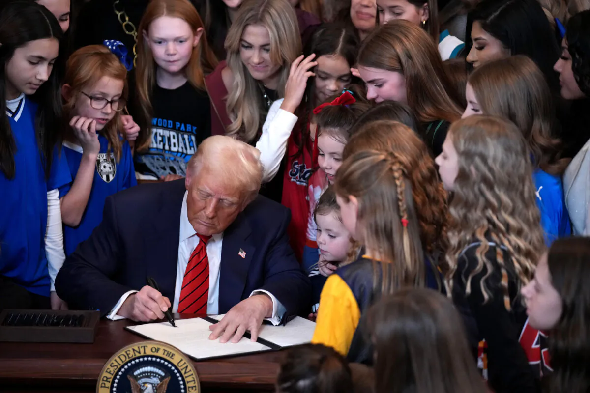 President Donald Trump joined by women athletes signs the “No Men in Women’s Sports” executive order in the East Room at the White House on Feb. 5, 2025. (Andrew Harnik/Getty Images)