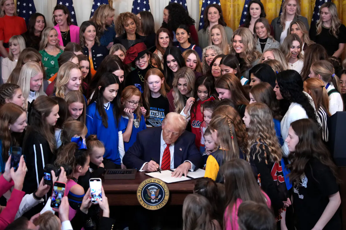 President Donald Trump joined by women athletes signs the “No Men in Women’s Sports” executive order in the East Room at the White House on Feb. 5, 2025. (Andrew Harnik/Getty Images)