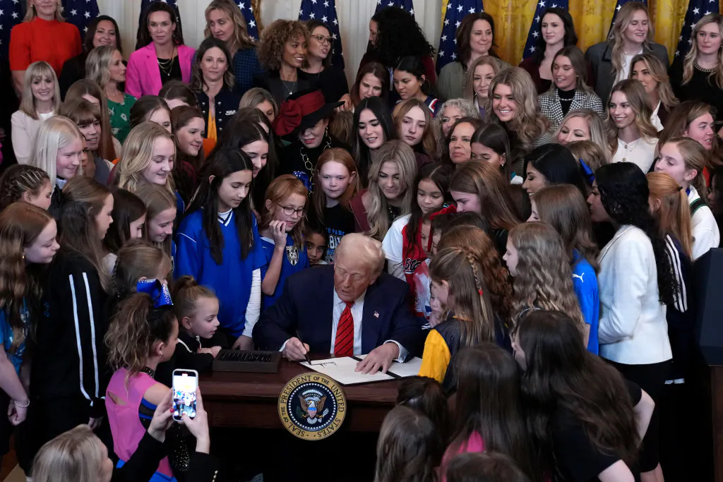 President Donald Trump, joined by female athletes, signs the “No Men in Women’s Sports” executive order in the East Room of the White House on Feb. 5, 2025. (Andrew Harnik/Getty Images)