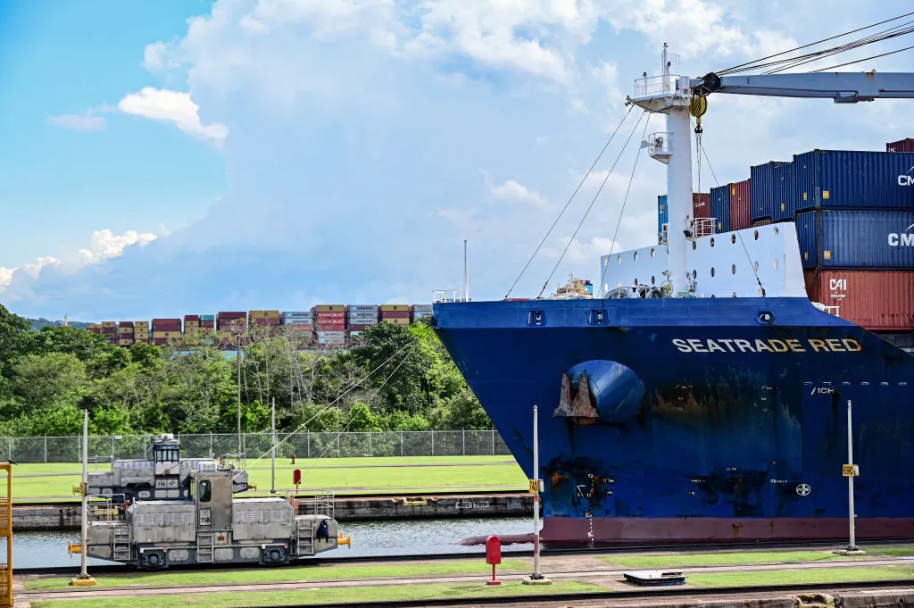 Locomotives help guide a cargo ship as it passes through the Miraflores locks while transiting the Panama Canal near Panama City on May 24, 2024. (Martin Bernetti/AFP via Getty Images)