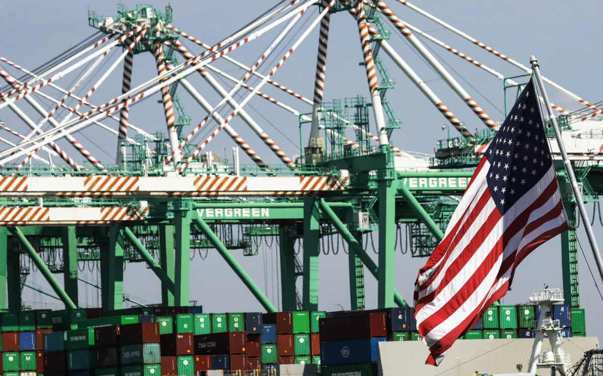 Cranes stand above shipping containers at the Port of Los Angeles in Terminal Island, Calif., on March 6, 2020. (Mario Tama/Getty Images)