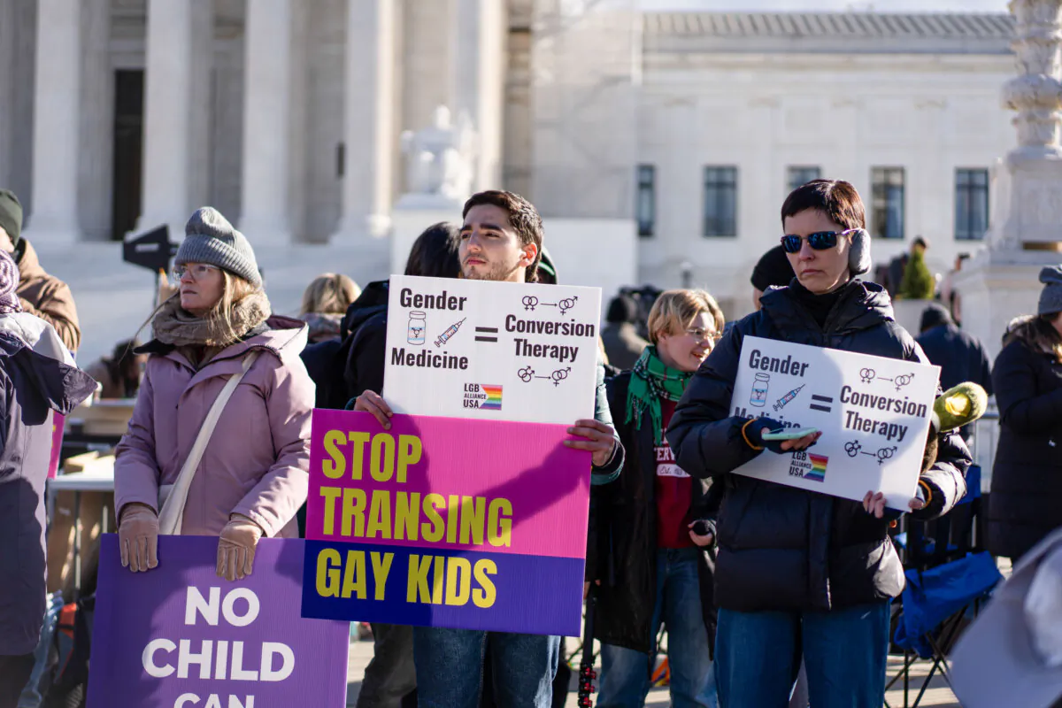 Protesters gather outside as the Supreme Court hears a case over banning transgender procedures for minors in Washington on Dec. 4, 2024. (Madalina Vasiliu/The Epoch Times)
