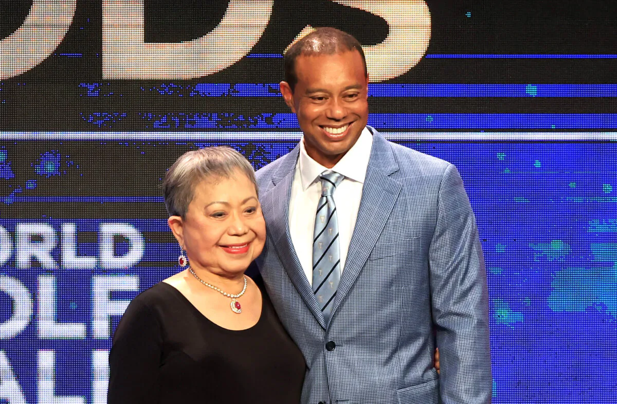 Tiger Woods and his mother Kultida Woods react as they pose for photos prior to his induction at the 2022 World Golf Hall of Fame Induction at the PGA TOUR Global Home in Ponte Vedra Beach, Fla., on March 09, 2022. (Sam Greenwood/Getty Images)