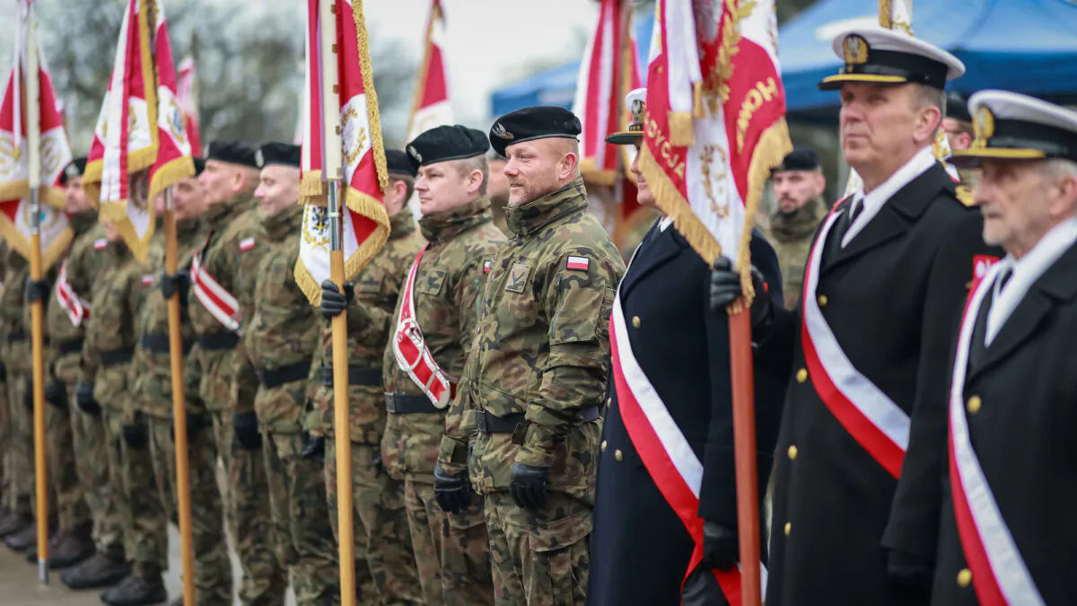 Polish army and navy officers on parade on Navy Day in front of the ORP Błyskawica Ship Museum in Gdynia, Poland, on Nov. 28, 2024. (Polish Ministry of Defense/Flickr)