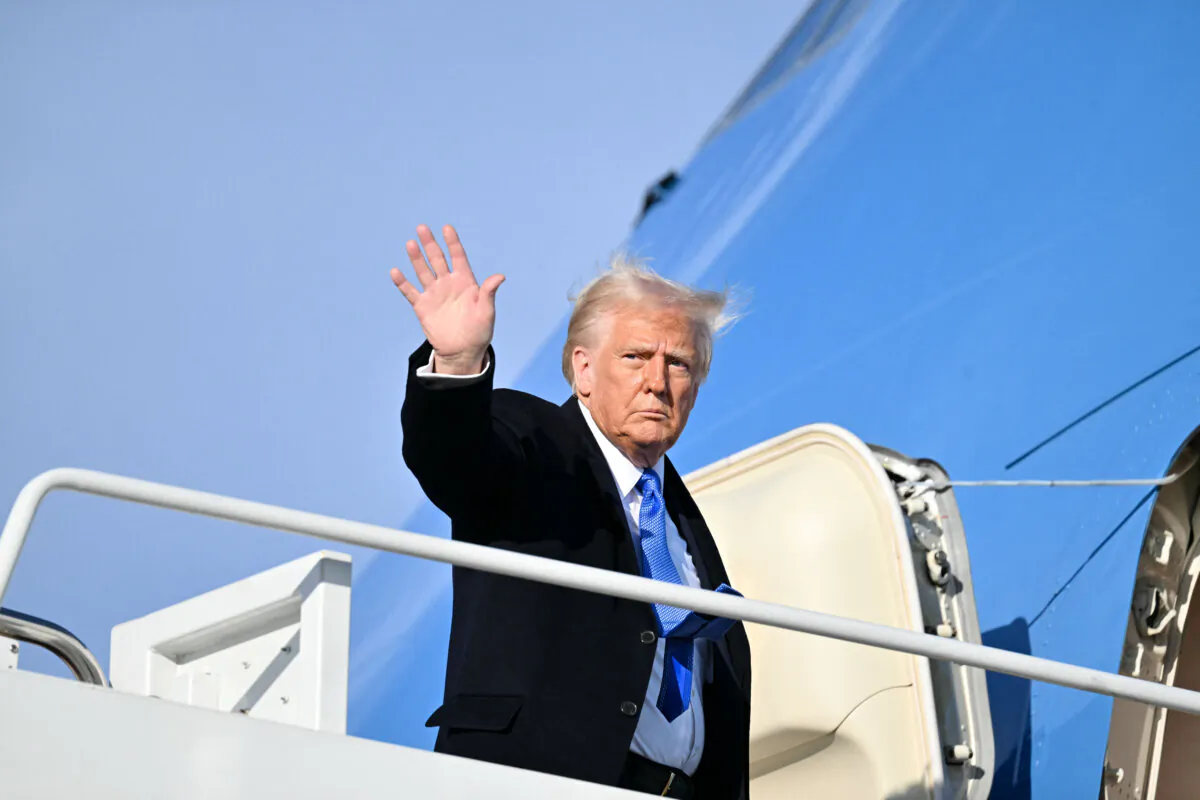US President Donald Trump waves as he boards Air Force One at Joint Base Andrews in Maryland on Feb. 7, 2025. (Roberto Schmidt/AFP via Getty Images)