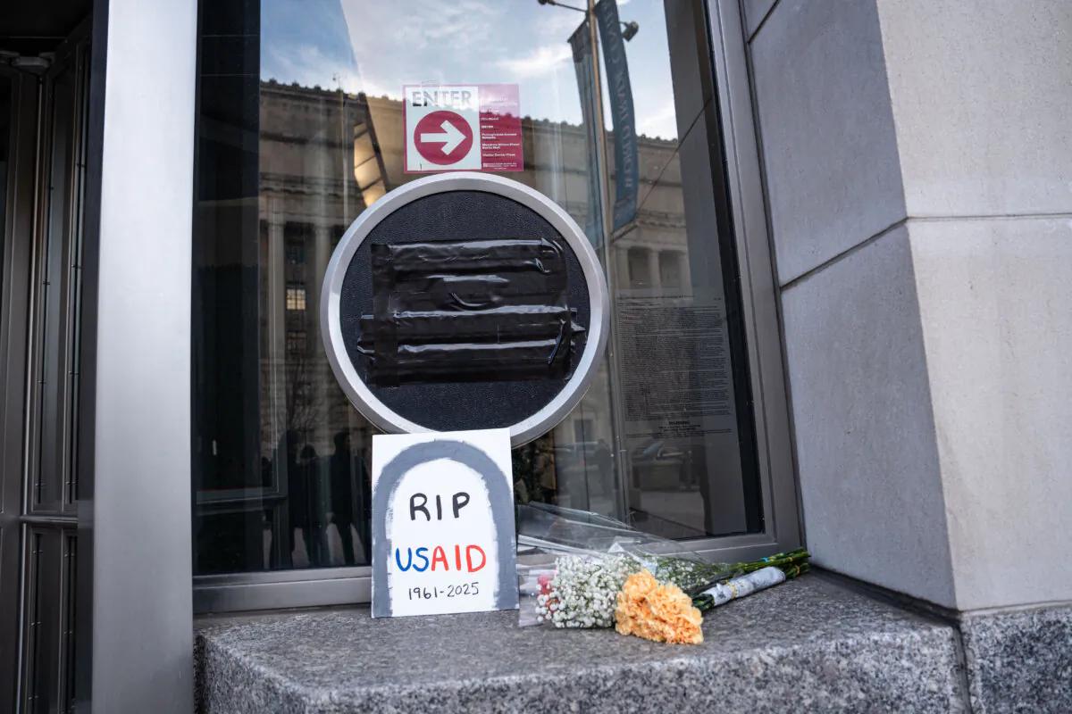 The U.S. Agency for International Development logo is covered with black tape in Washington on Feb. 7, 2025. (Madalina Vasiliu/The Epoch Times)