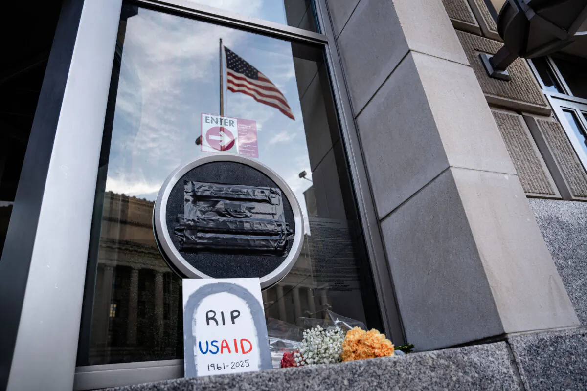 The U.S. Agency for International Development logo is covered with black tape in Washington on Feb. 7, 2025. (Madalina Vasiliu/The Epoch Times)