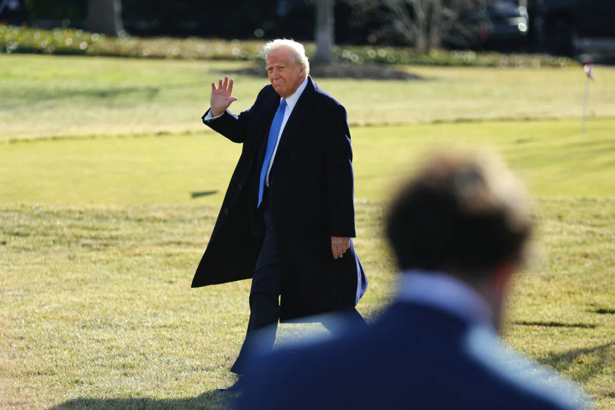 President Donald Trump waves to members of the media before boarding Marine One at the White House on Feb. 7, 2025. (Bryan Dozier/Middle East Images via AFP via Getty Images)
