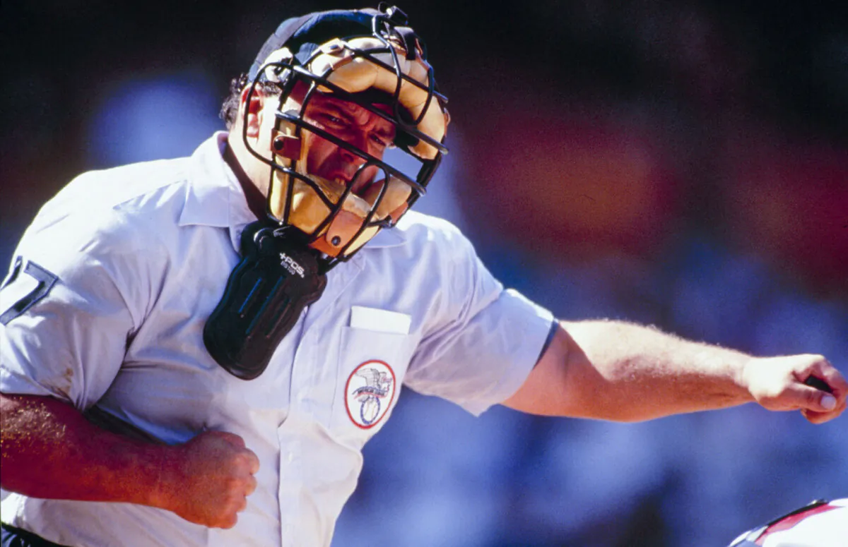 Umpire Rocky Roe calls a strike during the California Angels game against the Kansas City Royals at Anaheim Stadium in Anaheim, Calif., on Aug. 5, 1993. (Stephen Dunn/Getty Images)