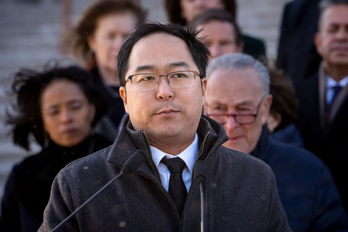Sen. Andy Kim (D-N.J.), joined by other Senate Democrats, speaks during a press conference at the Senate steps of the U.S. Capitol on Jan. 9, 2025. (Madalina Vasiliu/The Epoch Times)