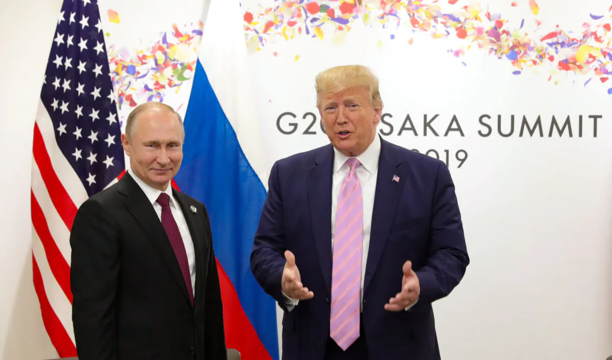 Russian President Vladimir Putin and U.S. President Donald Trump attend a meeting on the sidelines of the G20 summit in Osaka, Japan, on June 28, 2019. (Mikhail Klimentyev/Sputnik via Reuters)