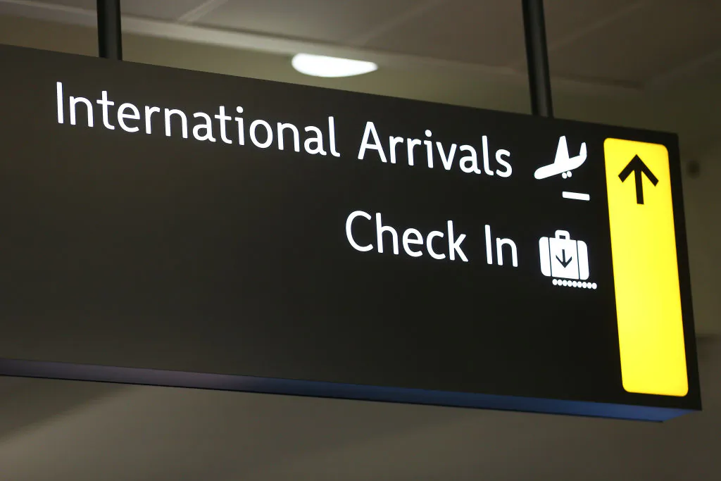 An international arrivals sign at Wellington Airport in New Zealand on March 16, 2020. (Hagen Hopkins/Getty Images)