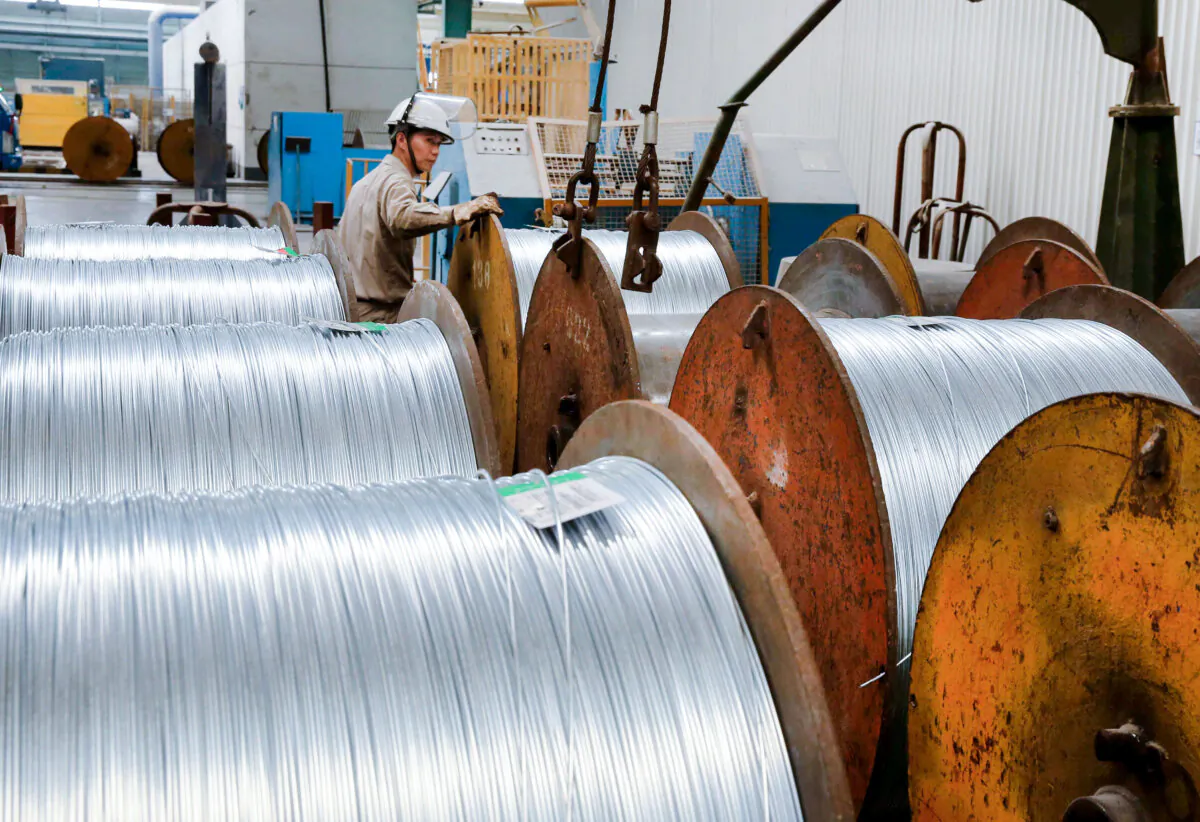 A worker handles steel cables at a steel factory in Nantong in eastern China's Jiangsu Province on July 3, 2018. (-/AFP/Getty Images)