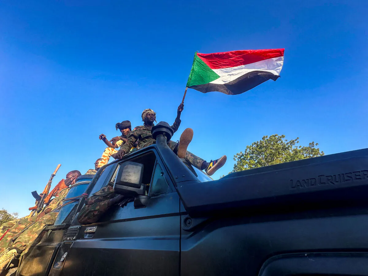 Sudan's army soldiers celebrate after entering Wad Madani, in Sudan, on Jan. 12, 2025. (El Tayeb Siddig/Reuters)