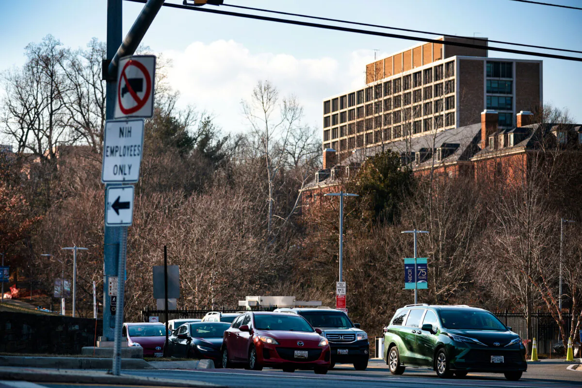 A sign that reads "NIH Employees Only" posted near an entrance at the National Institutes of Health headquarters in Bethesda, Md., on Feb. 10, 2025. Attorneys general from 22 states filed a lawsuit against the Trump administration and asked the court to block the proposed $4 billion a year budget cut in funding to biomedical researchers nationwide. (Photo by Alex Wong/Getty Images)