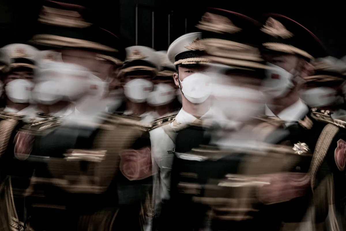 Chinese guards march during a ceremony at the Great Hall of the People in Beijing on July 10, 2023. (Andy Wong/POOL/AFP via Getty Images)