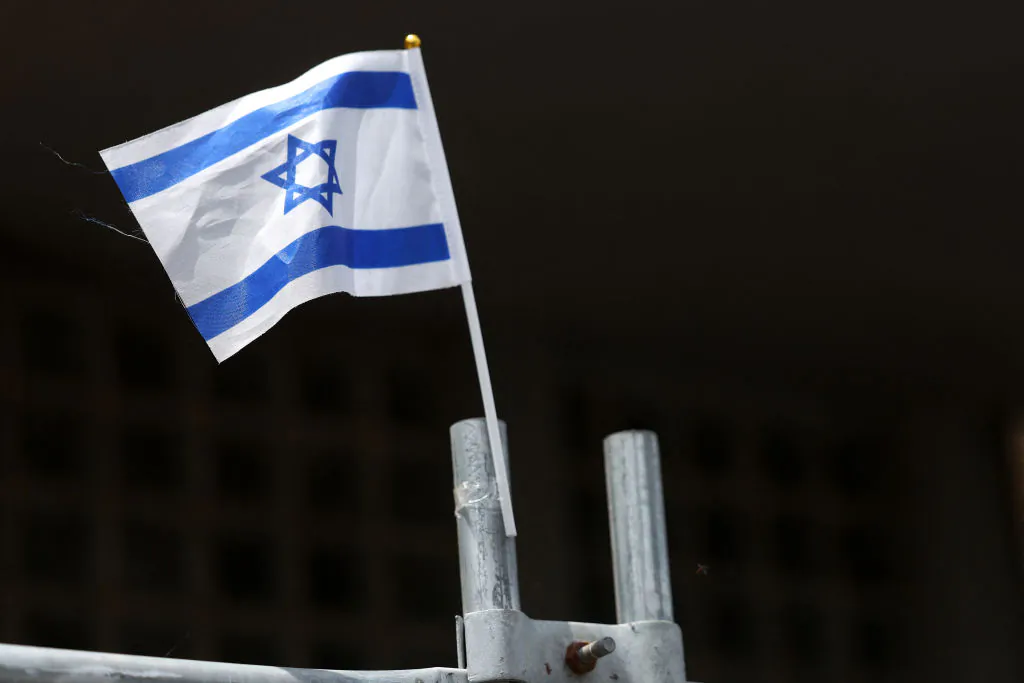 An Israeli flag is seen attached to the fence at the Adass Israel Synagogue in the Melbourne suburb of Ripponlea, Australia, on Dec. 9, 2024. (Martin Keep/AFP via Getty Images)
