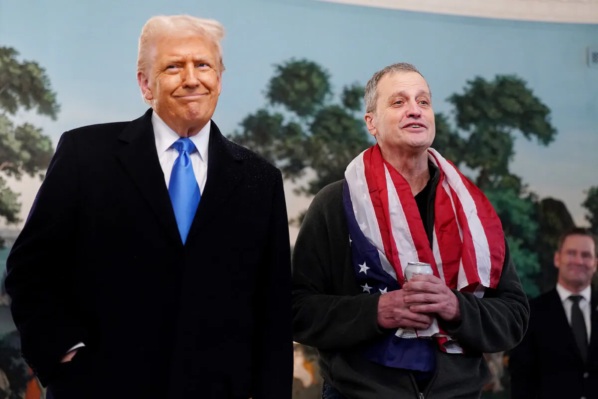 President Donald Trump welcomes Marc Fogel (R) back to the United States after being released from Russian custody, at the White House on Feb. 11, 2025. (Al Drago/Getty Images)