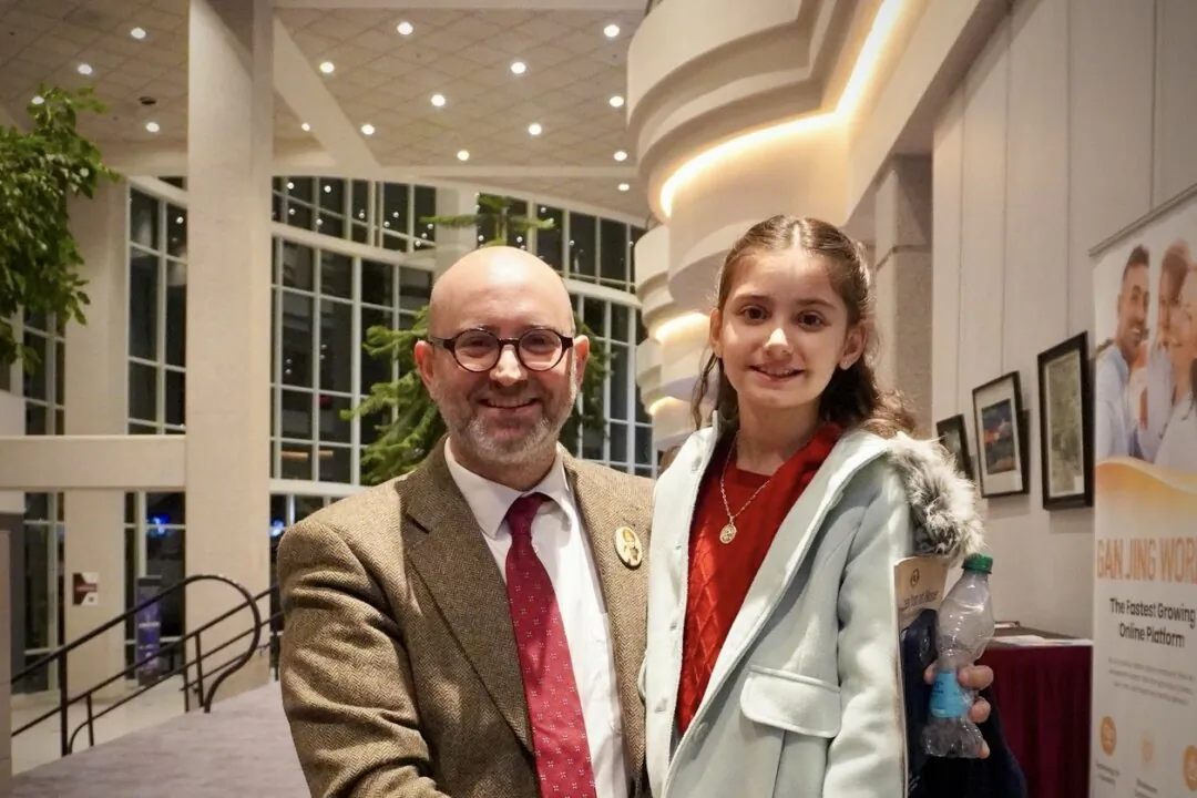 Enzo Selvaggi and his daughter Vittoria attend Shen Yun Performing Arts at the Juanita K. Hammons Hall for the Performing Arts in Springfield, Mo., on Feb. 11, 2025. (Sherry Dong/The Epoch Times)