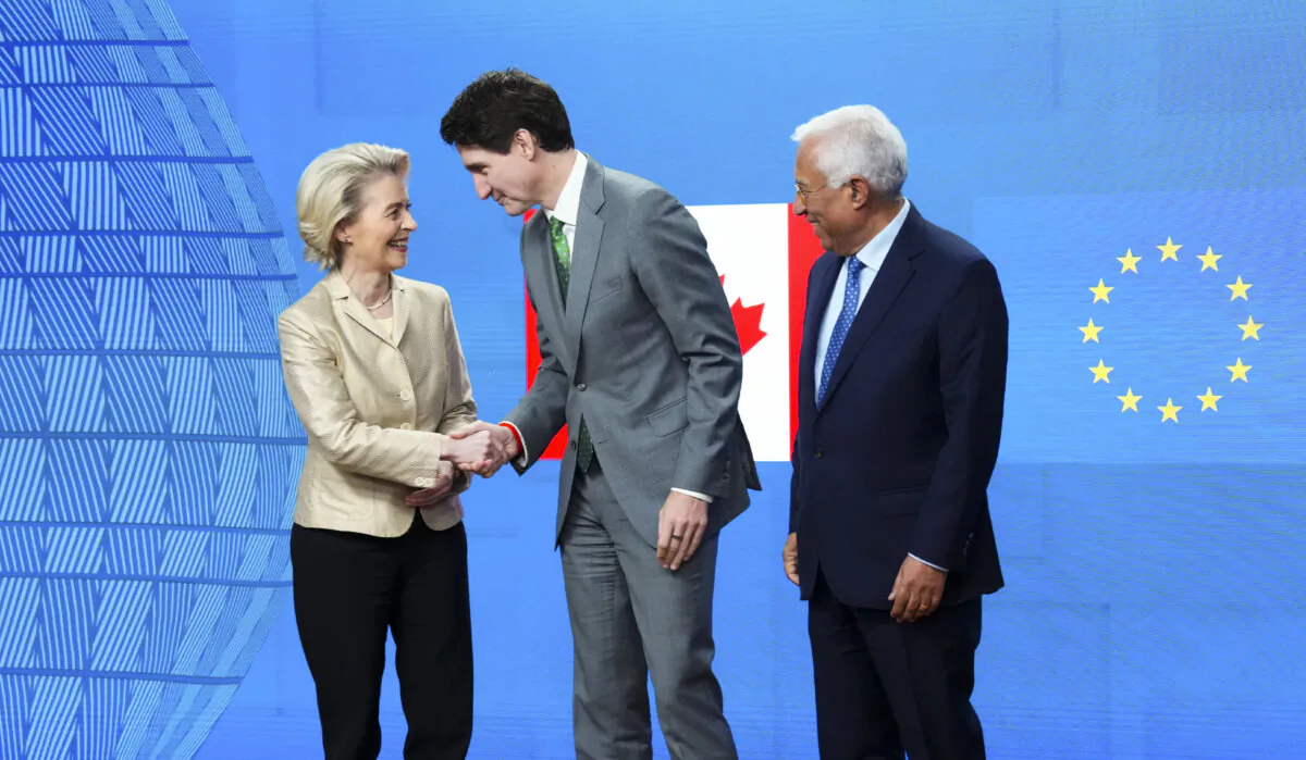Prime Minister Justin Trudeau is welcomed by European Commission President Ursula von der Leyen (L), and European Council President Antonio Costa, as he arrives to the EU-Canada leaders meeting at the European Council building in Brussels on Feb. 12, 2025. (The Canadian Press/Sean Kilpatrick)
