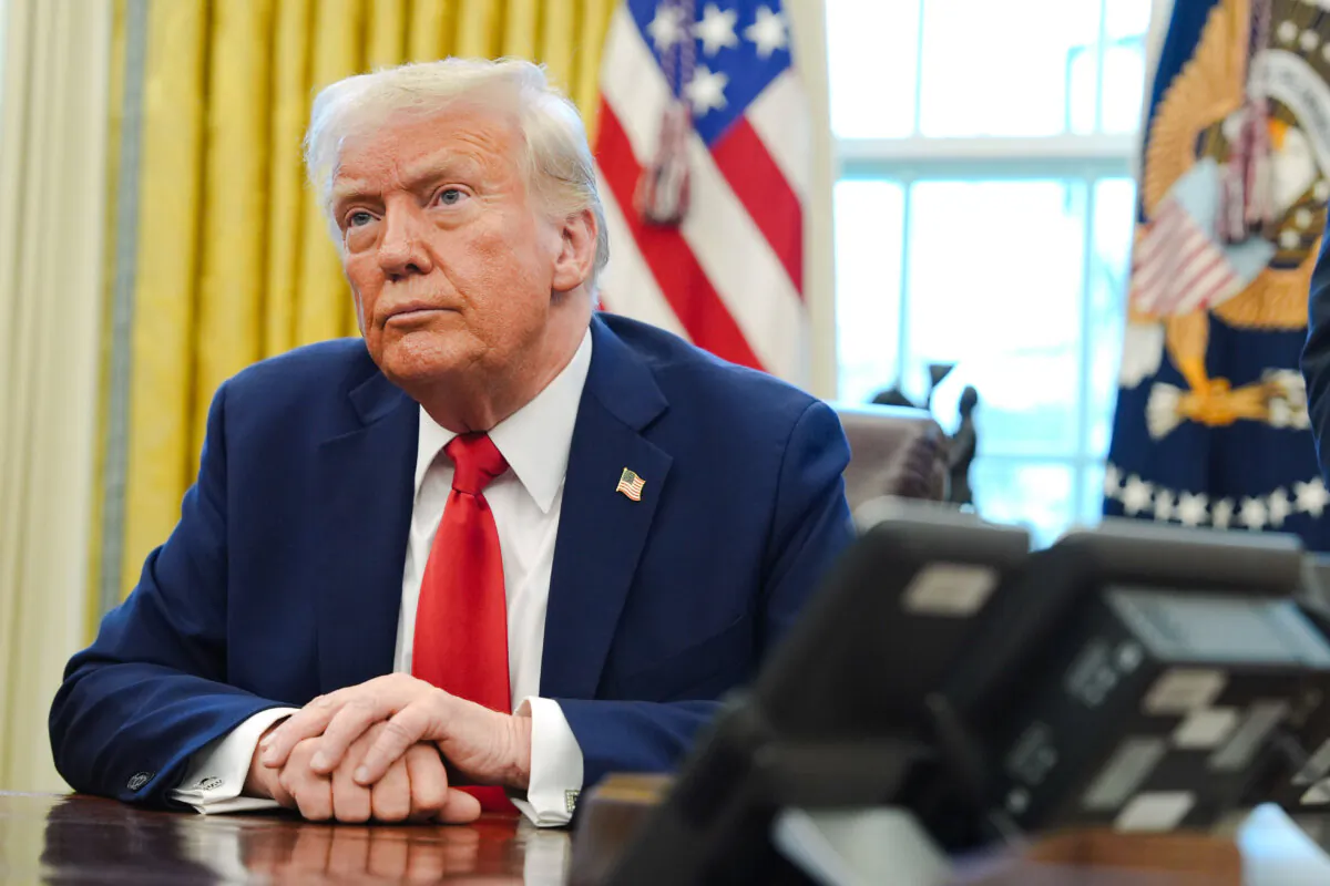 President Donald Trump listens after signing executive orders in the Oval Office of the White House in Washington on Feb. 3, 2025. (The Canadian Press/AP/Evan Vucci)
